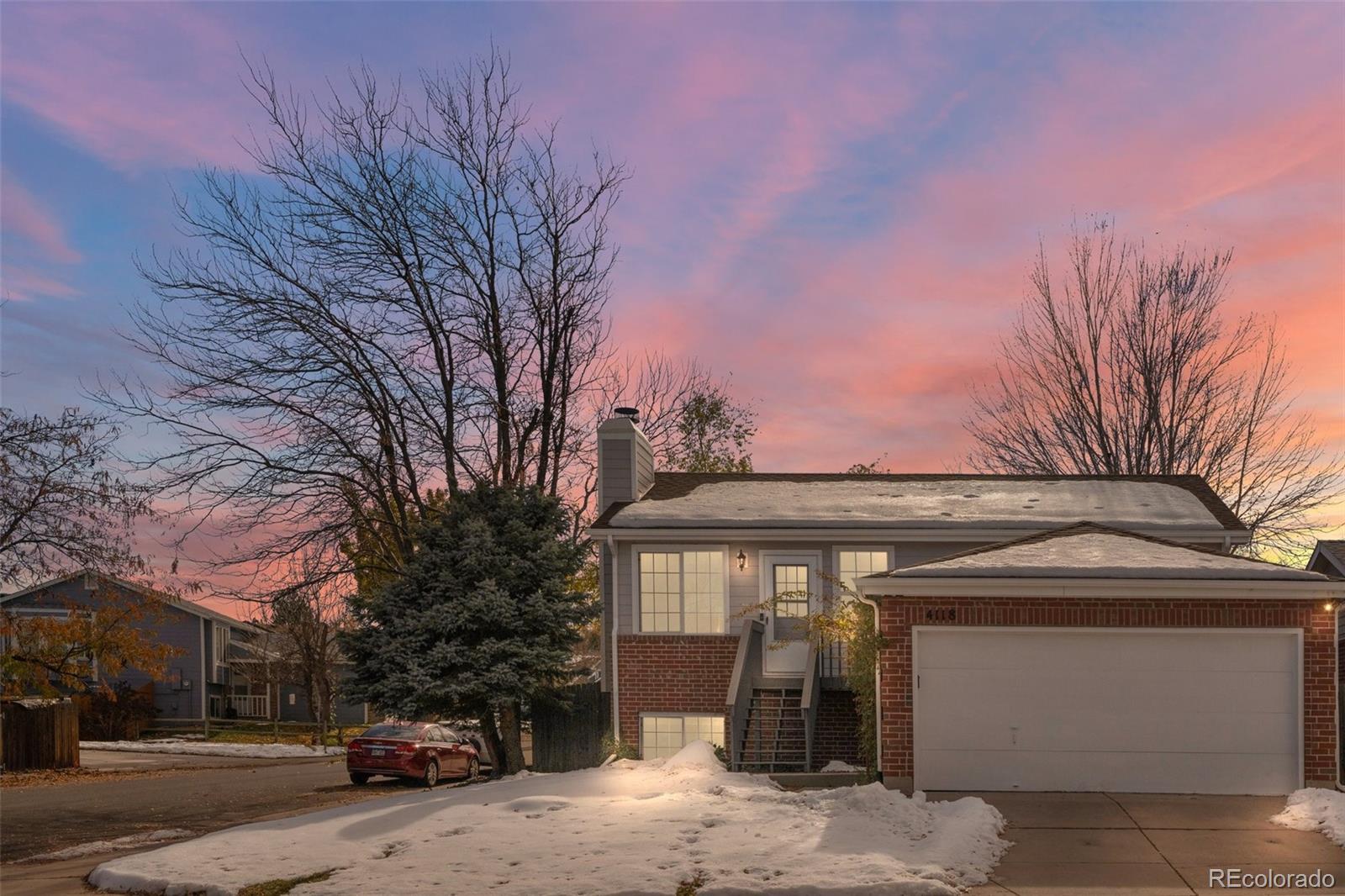 a front view of a house with a garage