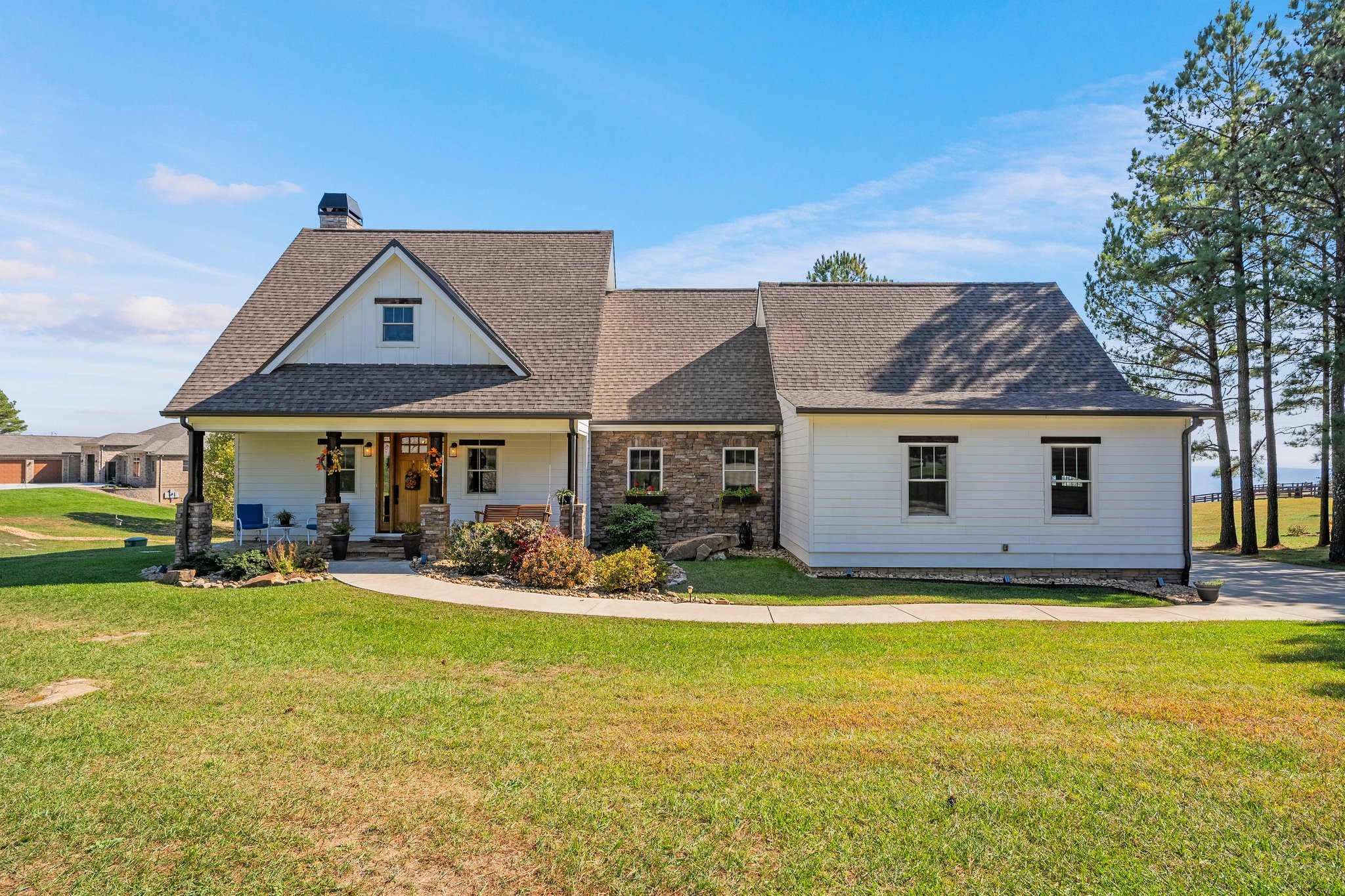 a view of a house with swimming pool and yard