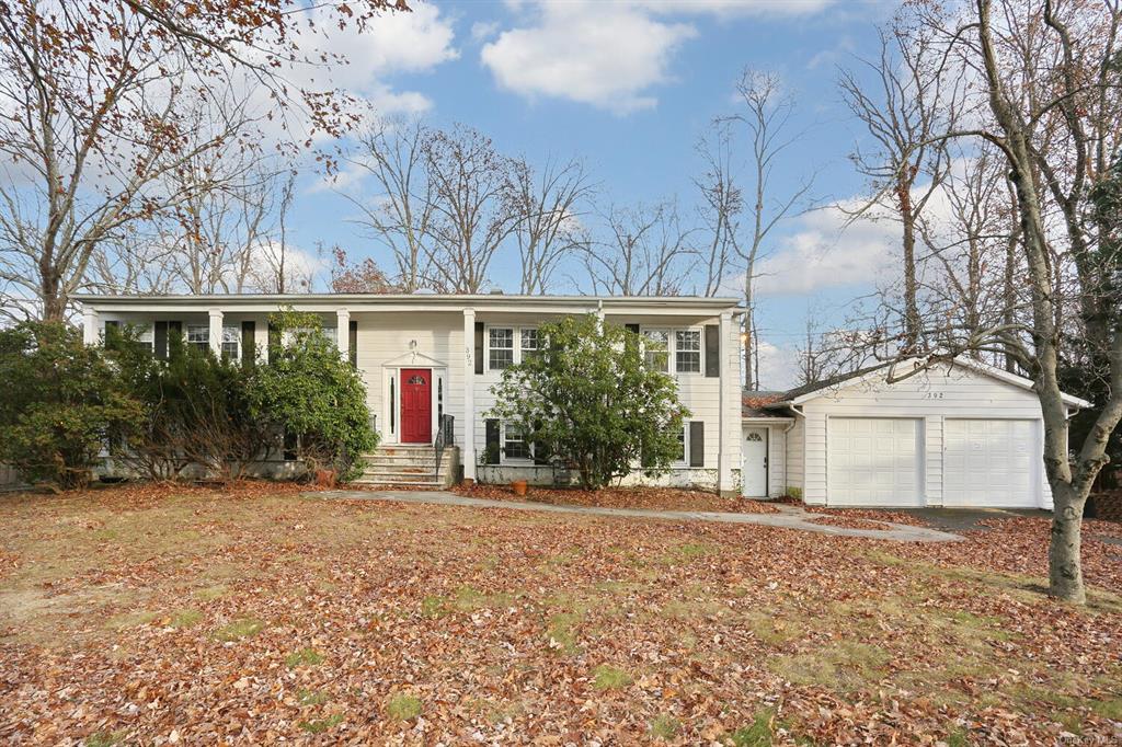 Raised ranch featuring a garage