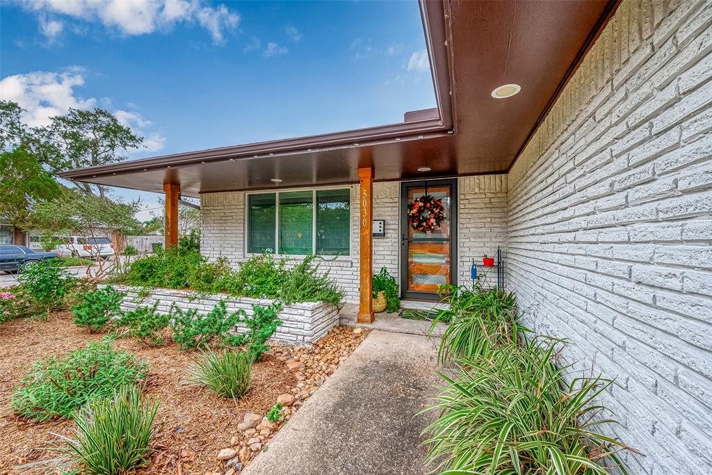 a porch with seating space and yard