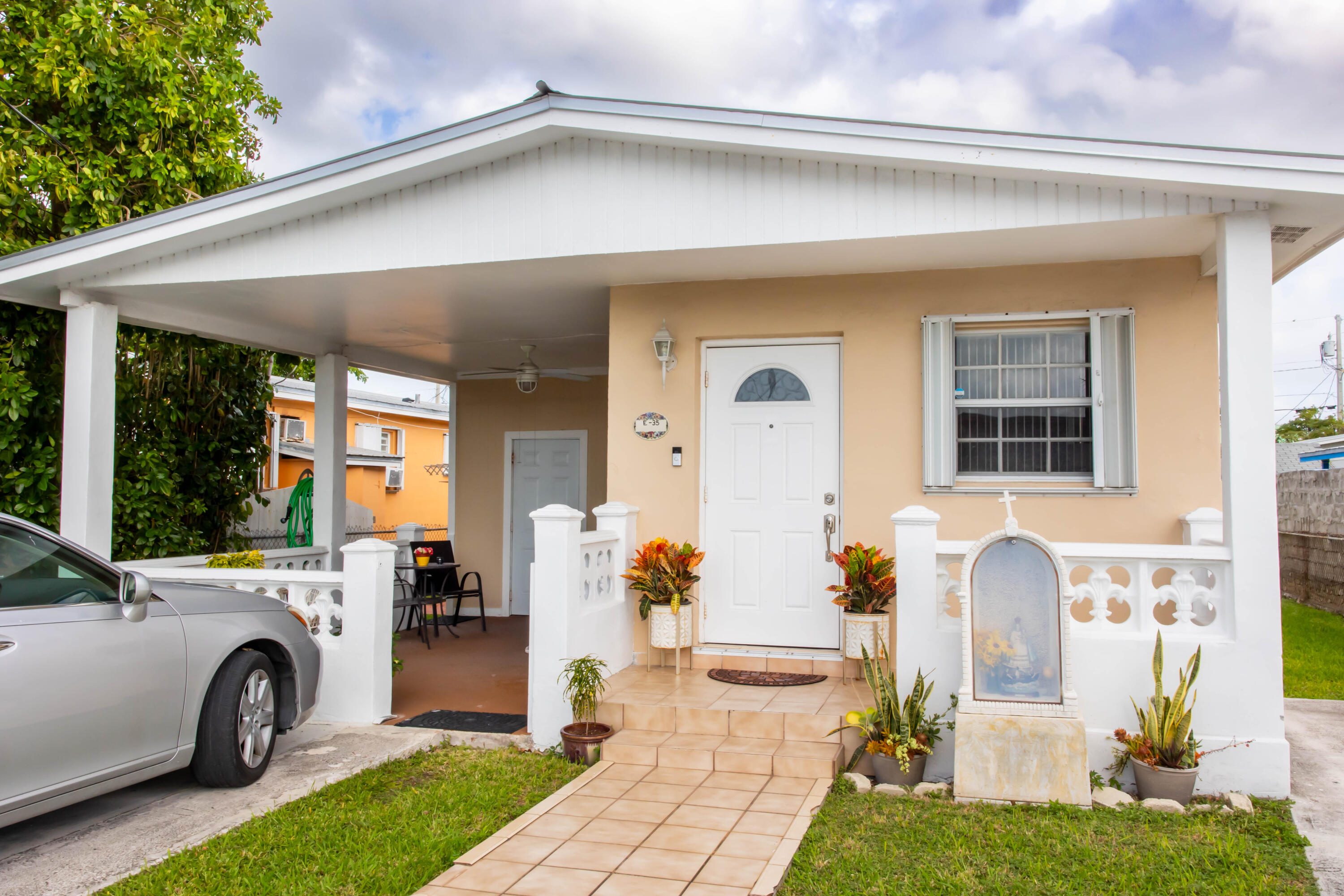 a front view of a house with garden