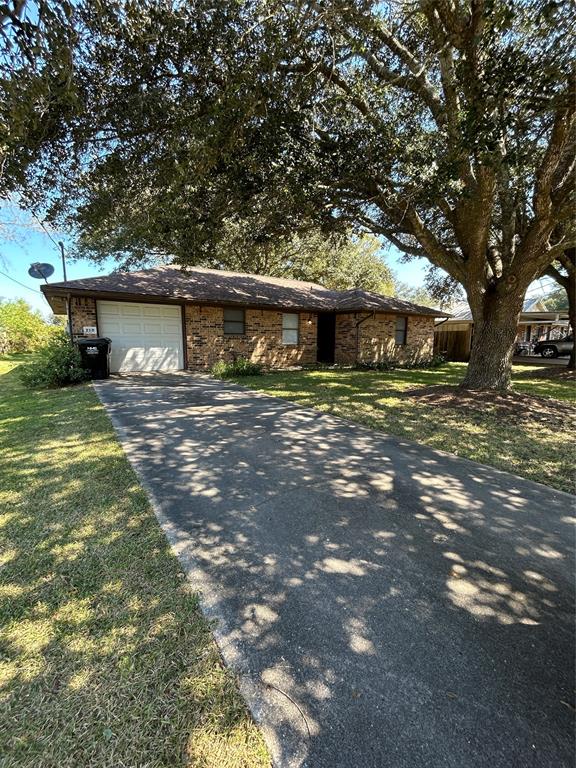 a front view of a house with yard