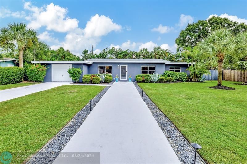 front view of a house with a yard