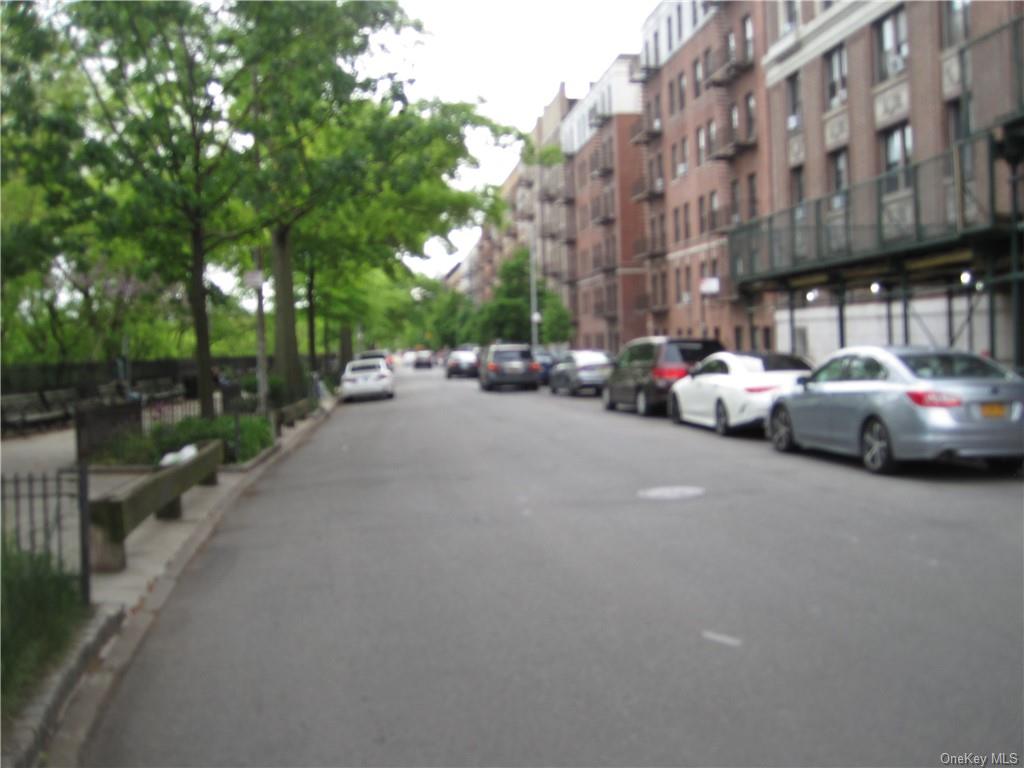 a view of a street with cars