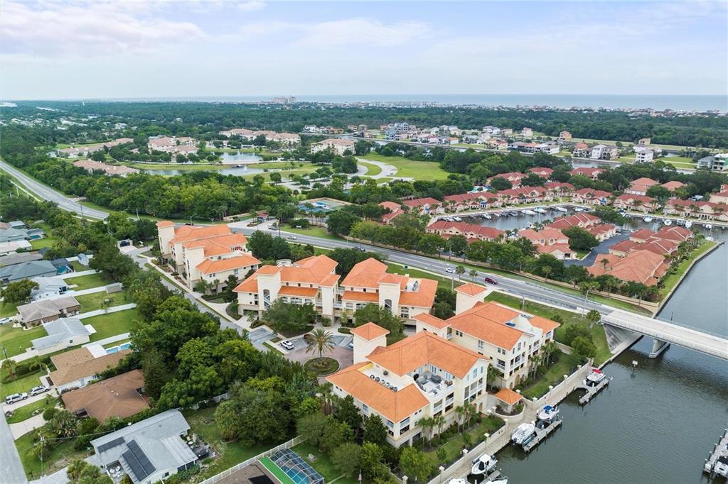 an aerial view of residential houses with outdoor space