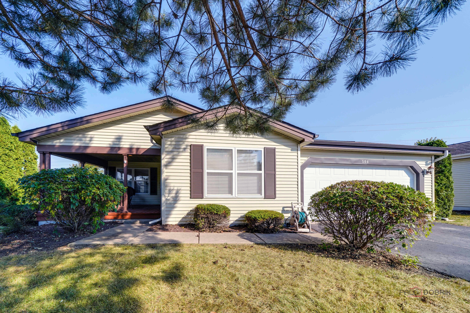 a front view of a house with garden