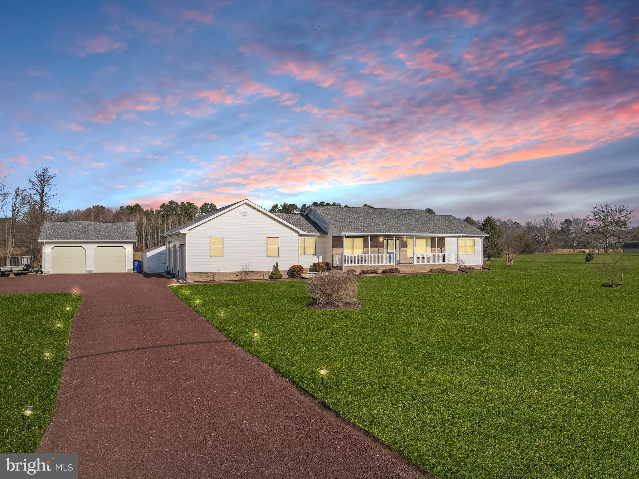 a front view of a house with yard