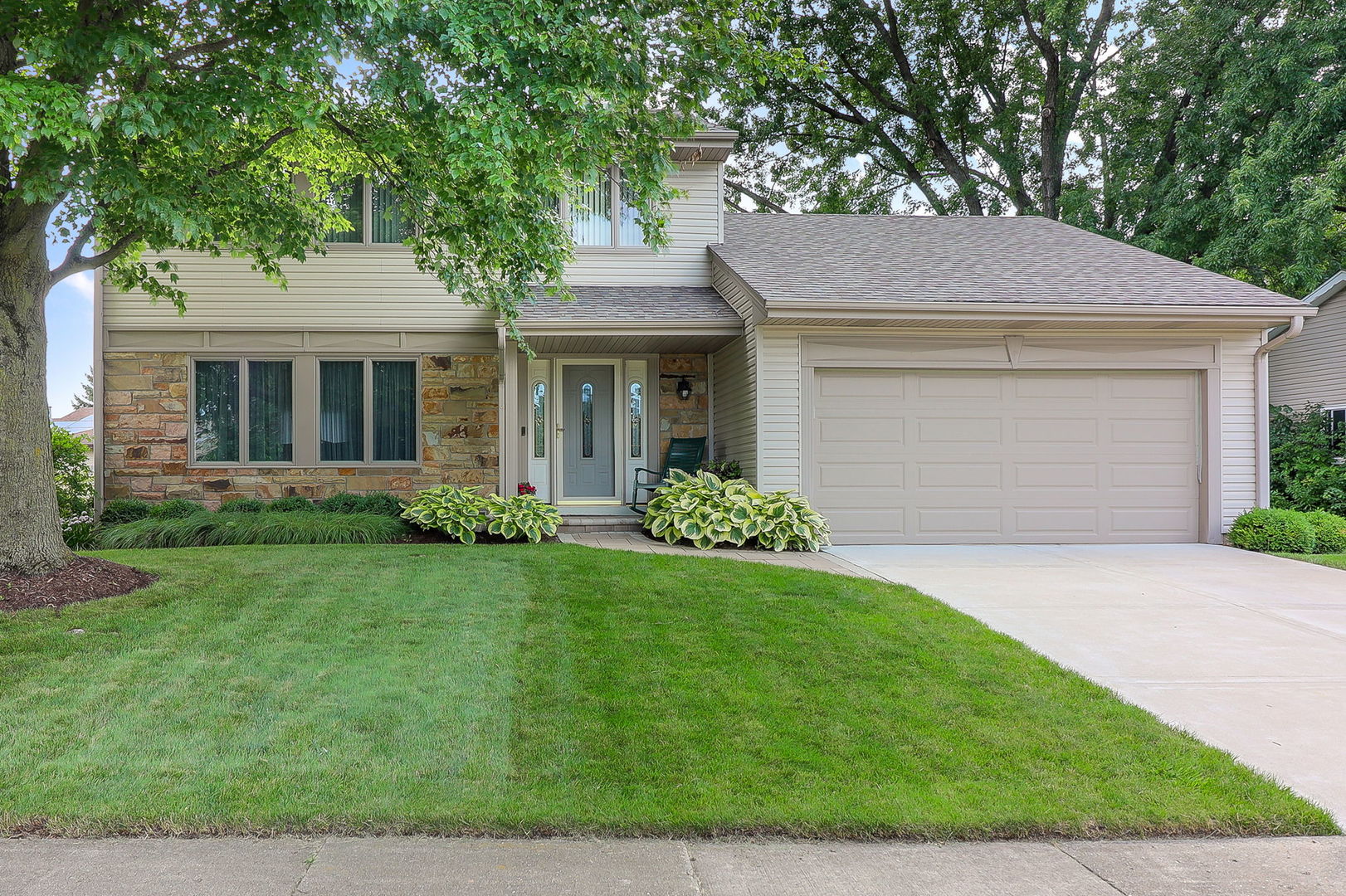 front view of a house with a yard