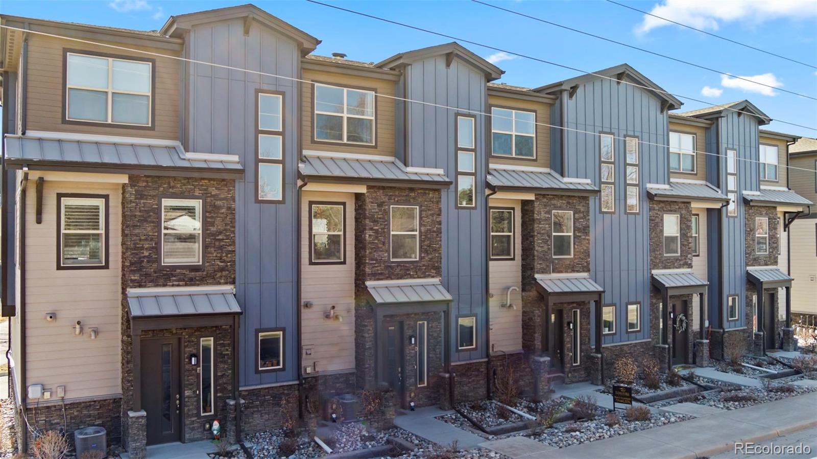 a front view of a residential apartment building with glass windows