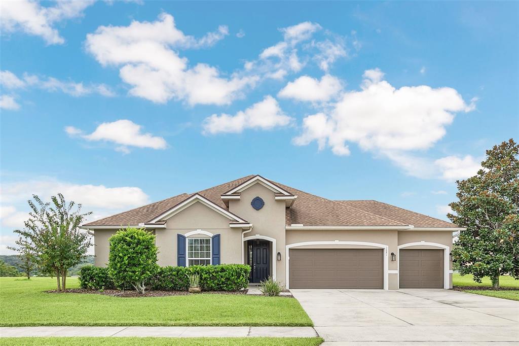 a front view of a house with a yard