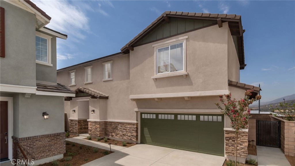 a front view of a house with a garage