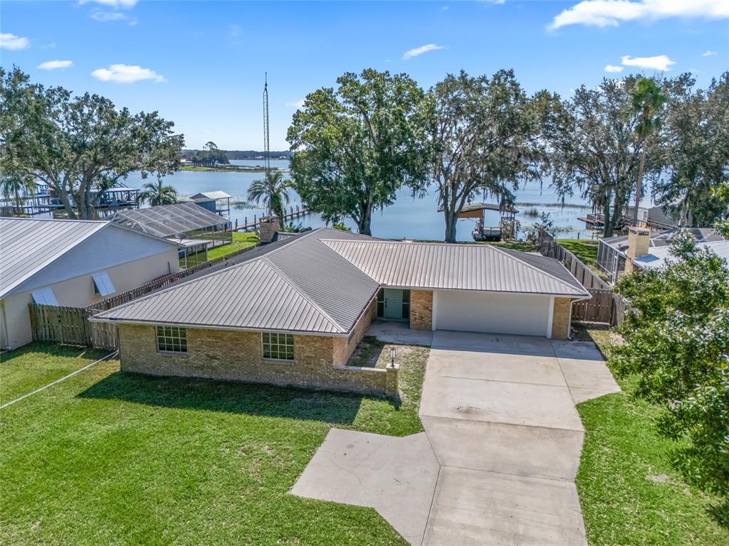 a aerial view of a house with a big yard