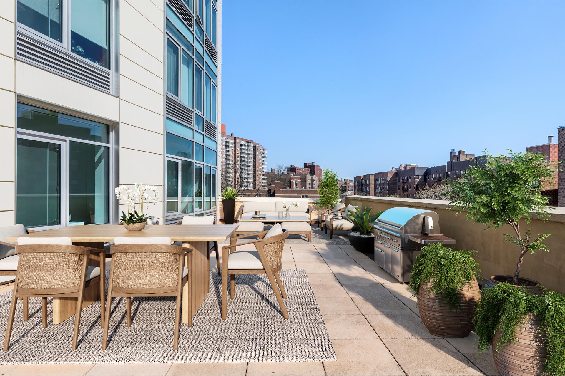 a view of a patio with couches table and chairs and potted plants