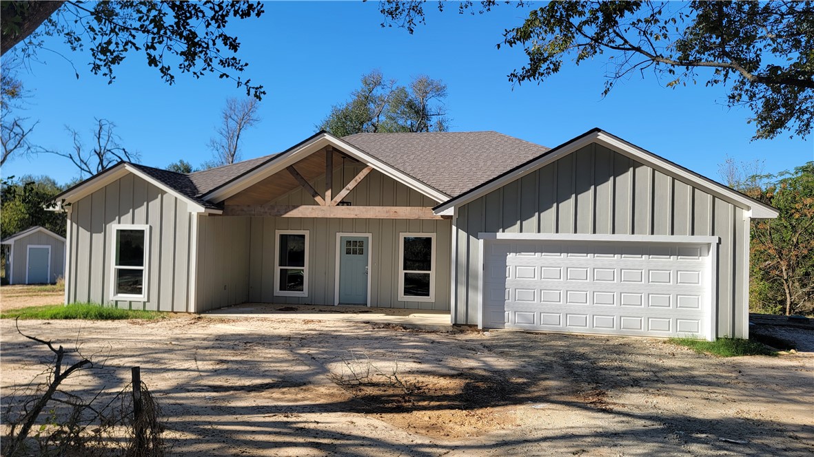 View of front facade featuring a garage