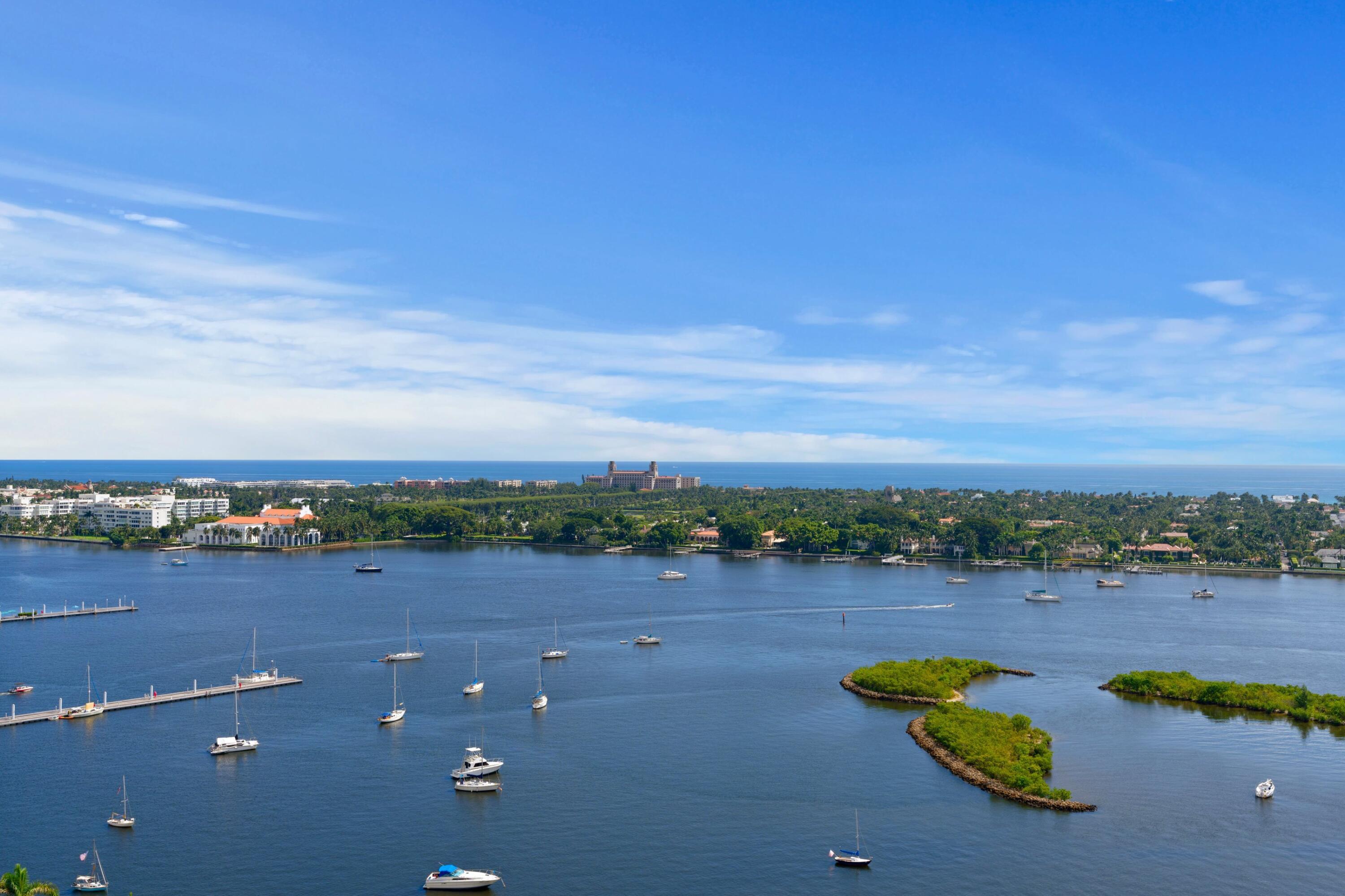 a view of a lake with houses in the back