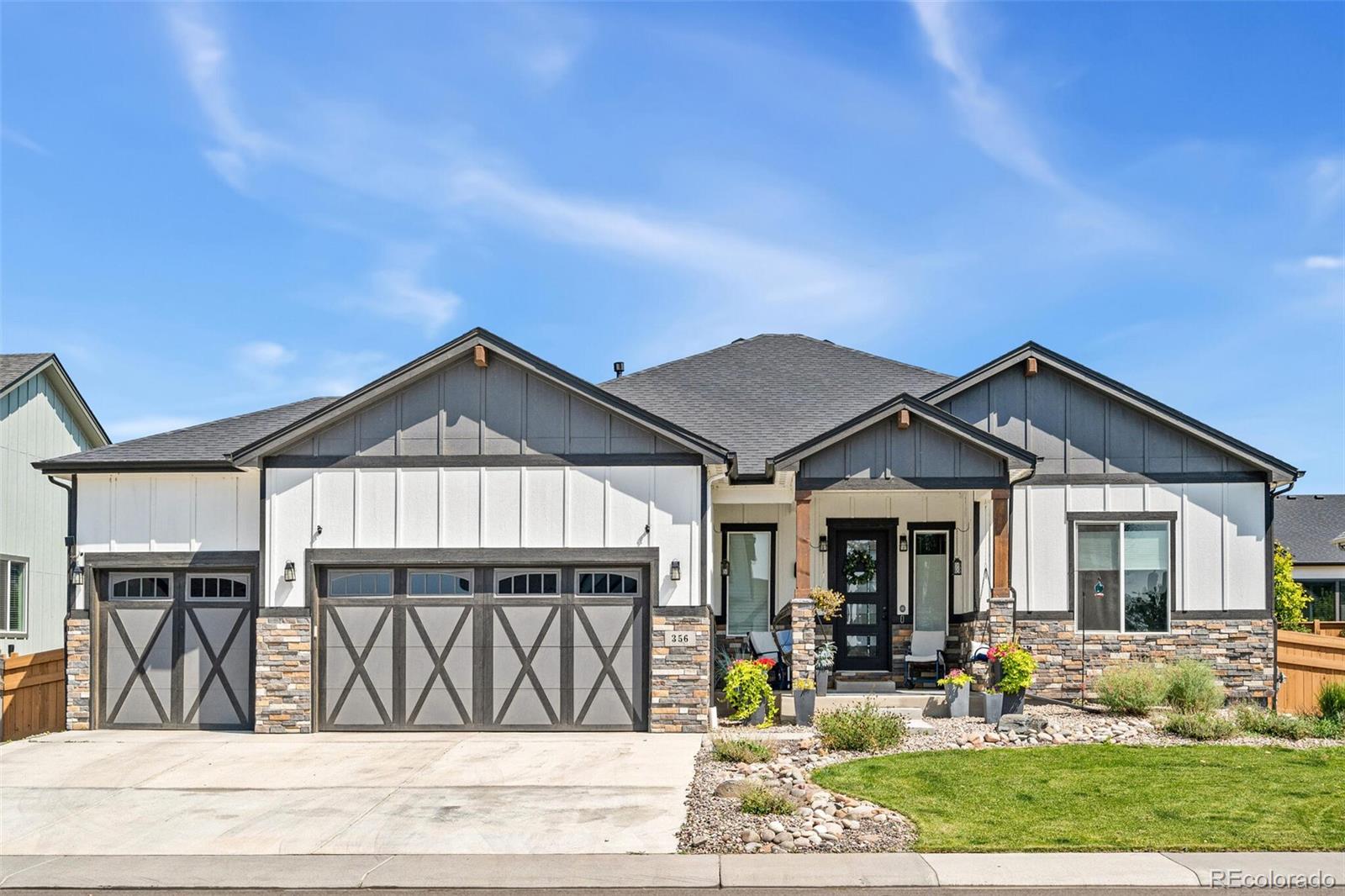 a front view of houses with yard outdoor seating and livingroom view