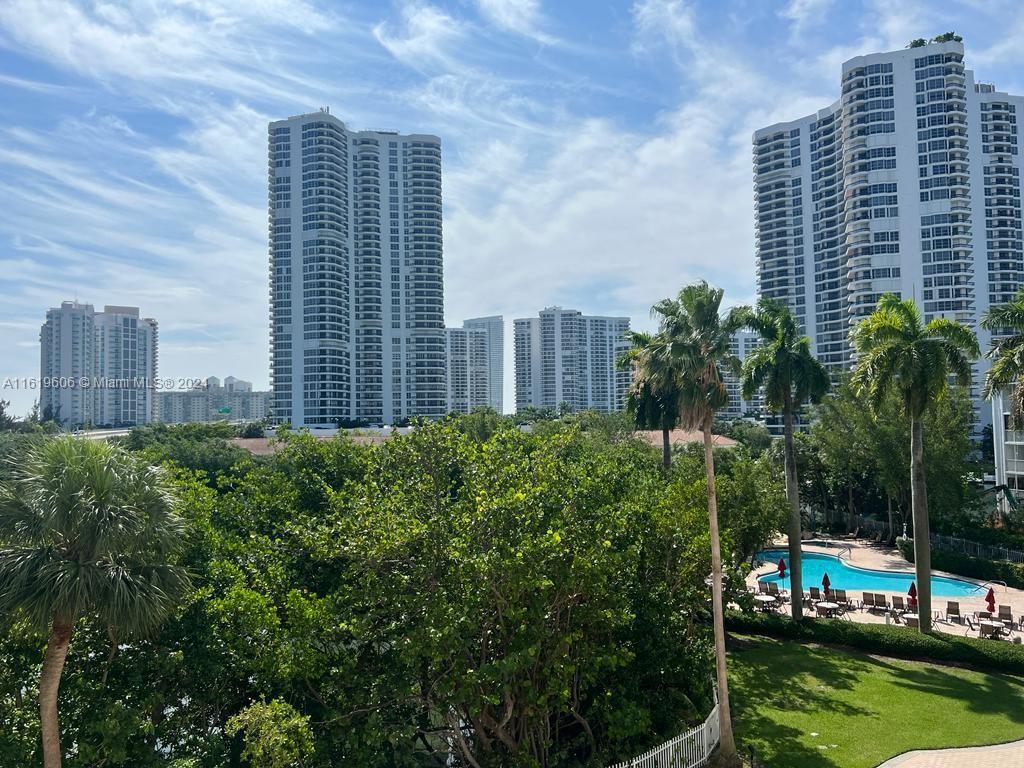 a view of a city with tall buildings