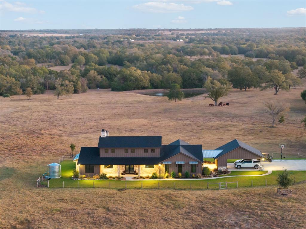 a view of house with yard