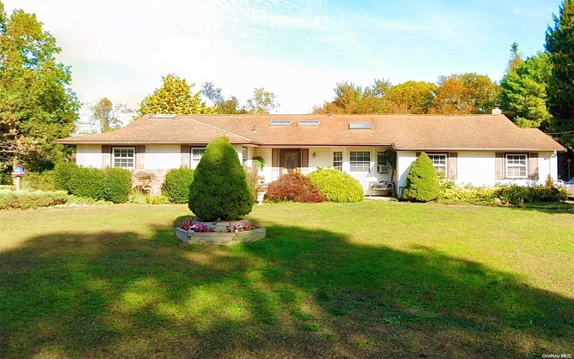 a view of a house with a garden