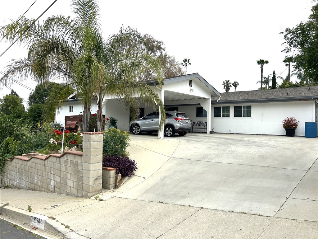 a front view of a building with garden