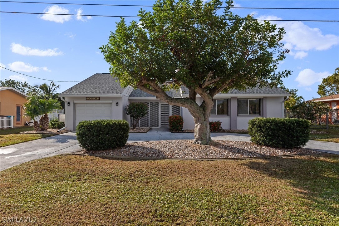 a view of a house with a yard