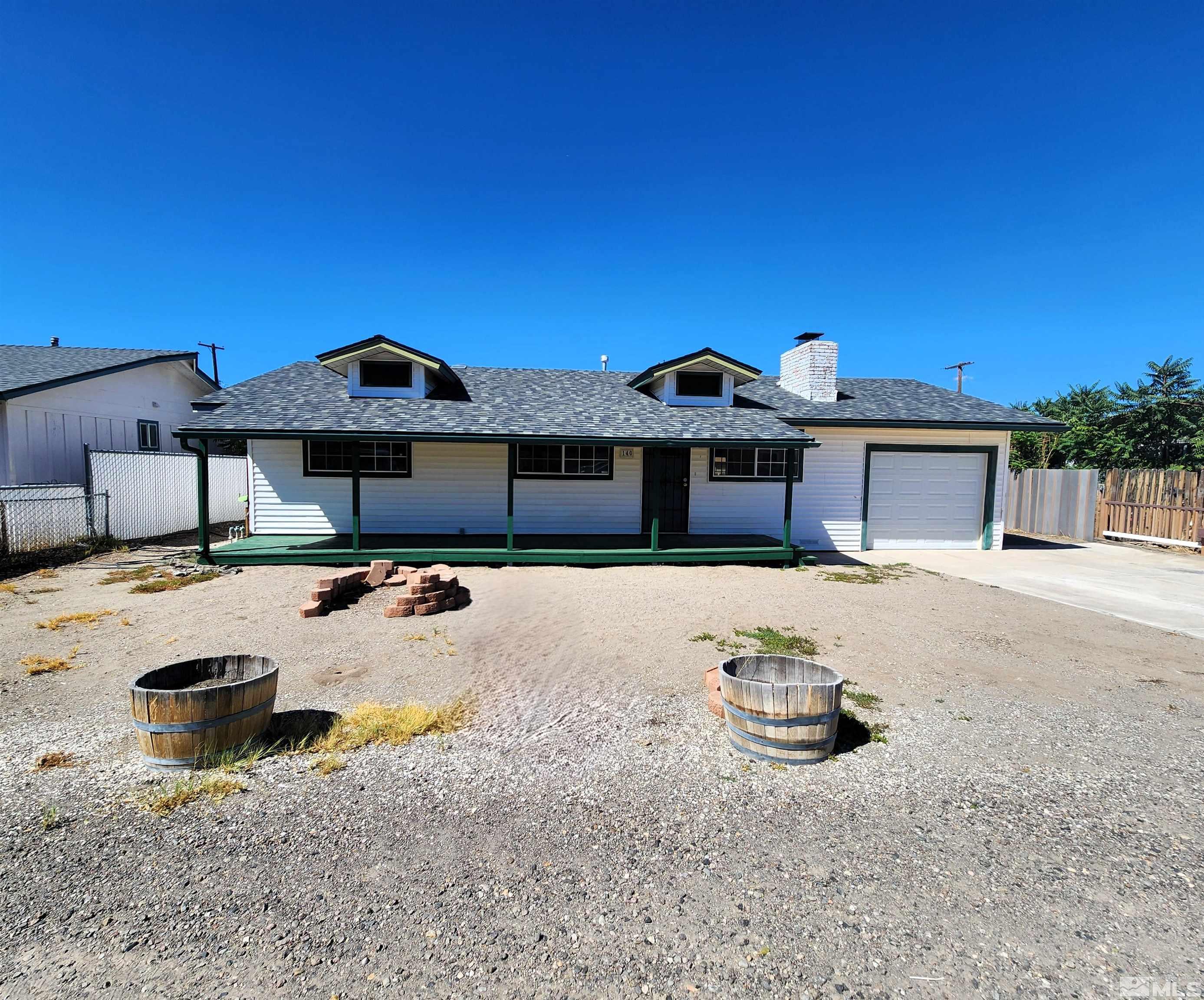 a front view of a house with swimming pool