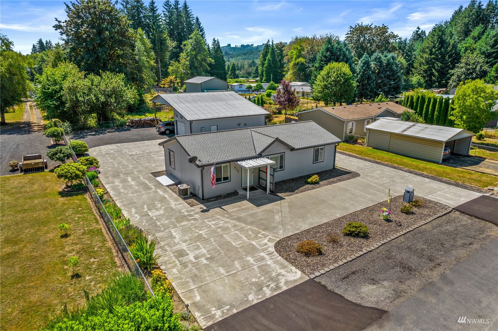 an aerial view of a house with swimming pool and big yard