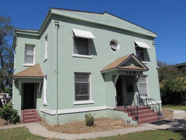 a front view of a house with garage