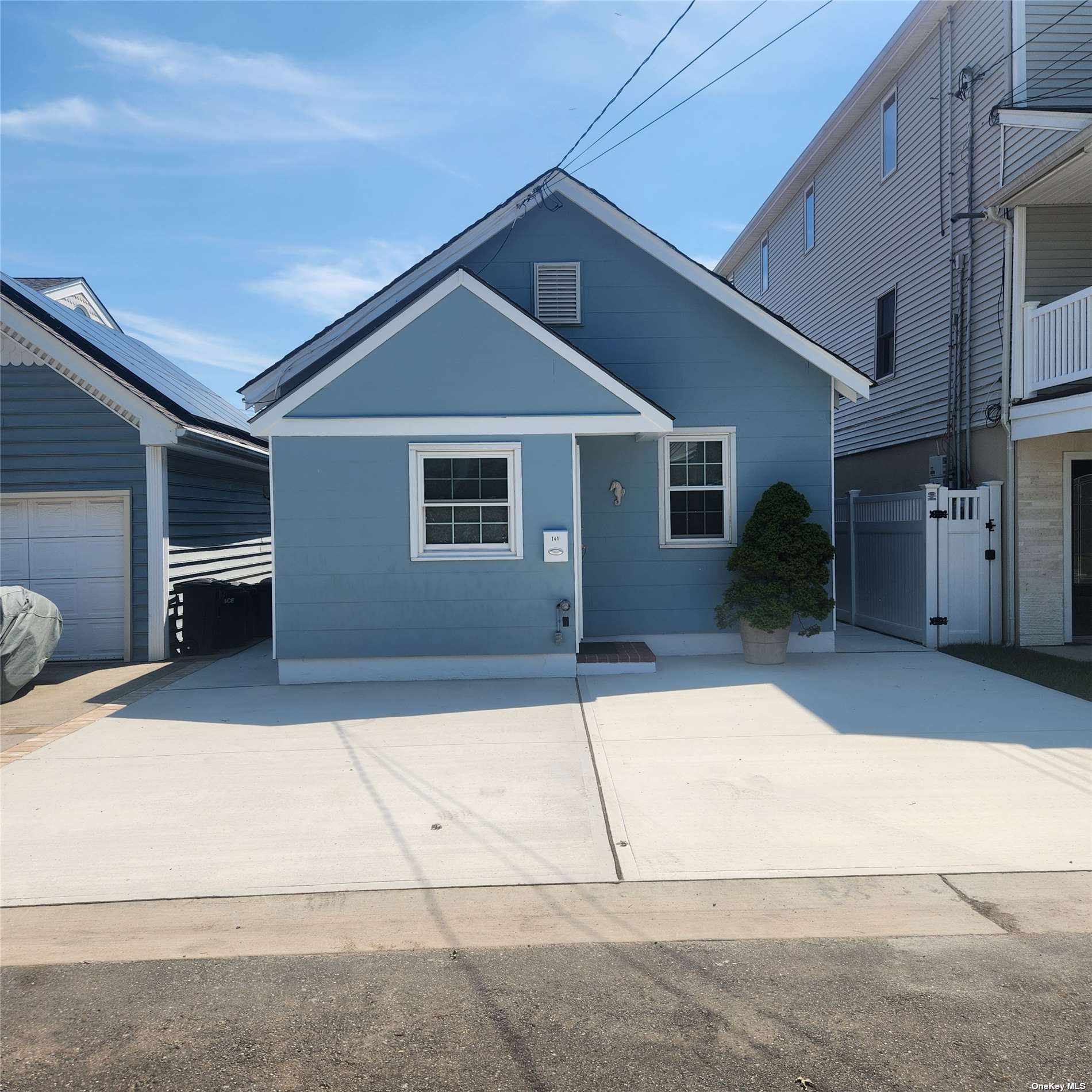 a front view of a house with garage