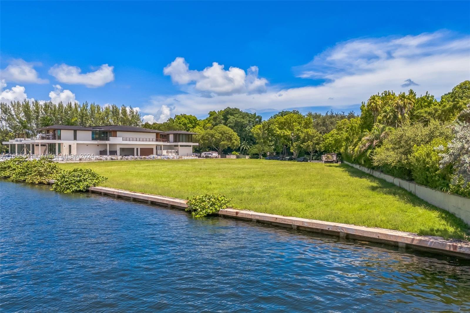 a view of a lake with a big yard