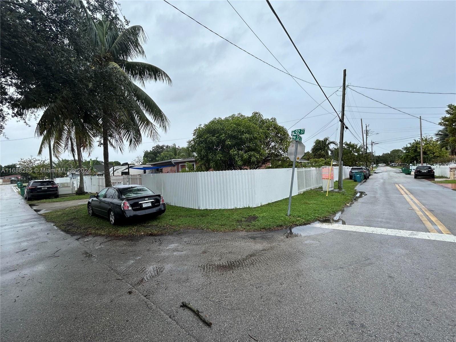 a view of street with parked cars