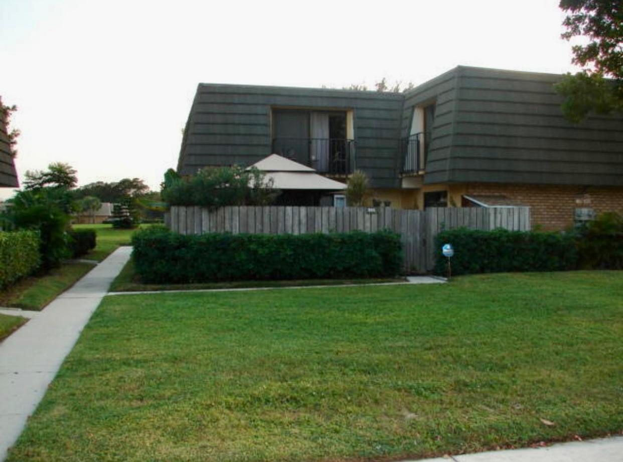 a view of a big yard next to a house