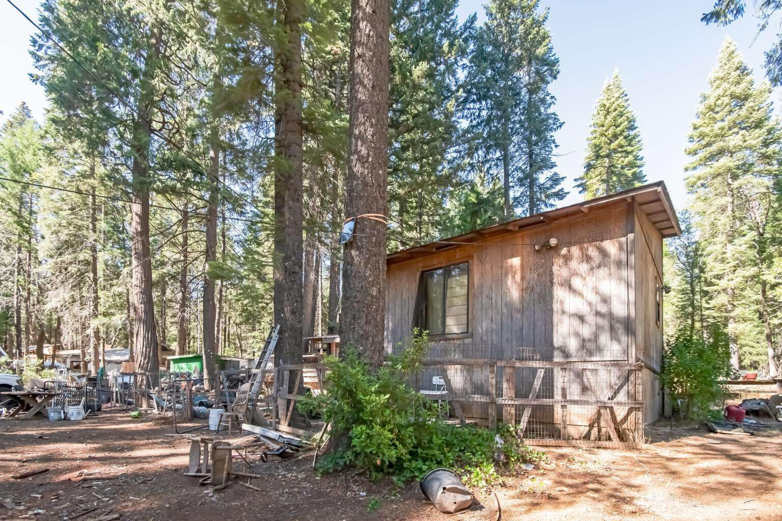 a view of a house with a yard and sitting area