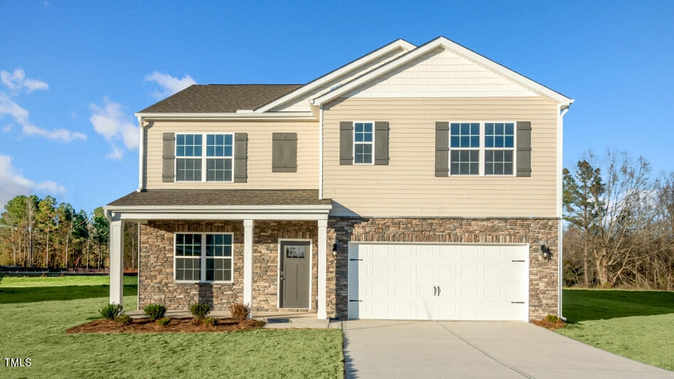 front view of a house with a yard