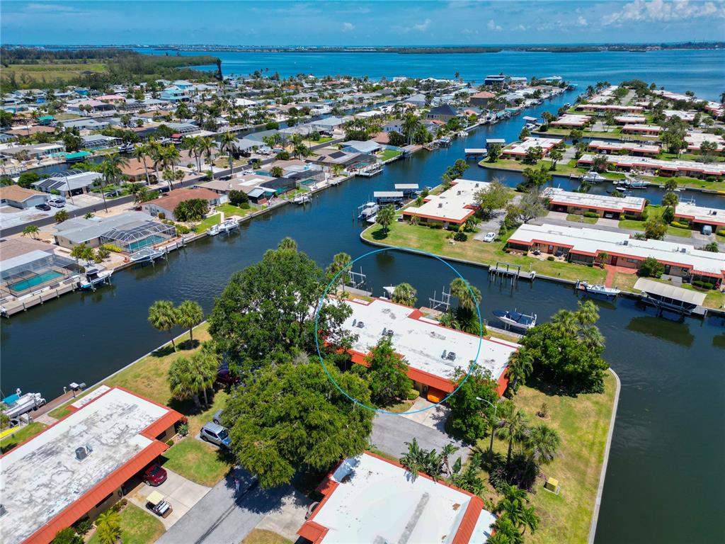 an aerial view of a house with a lake view