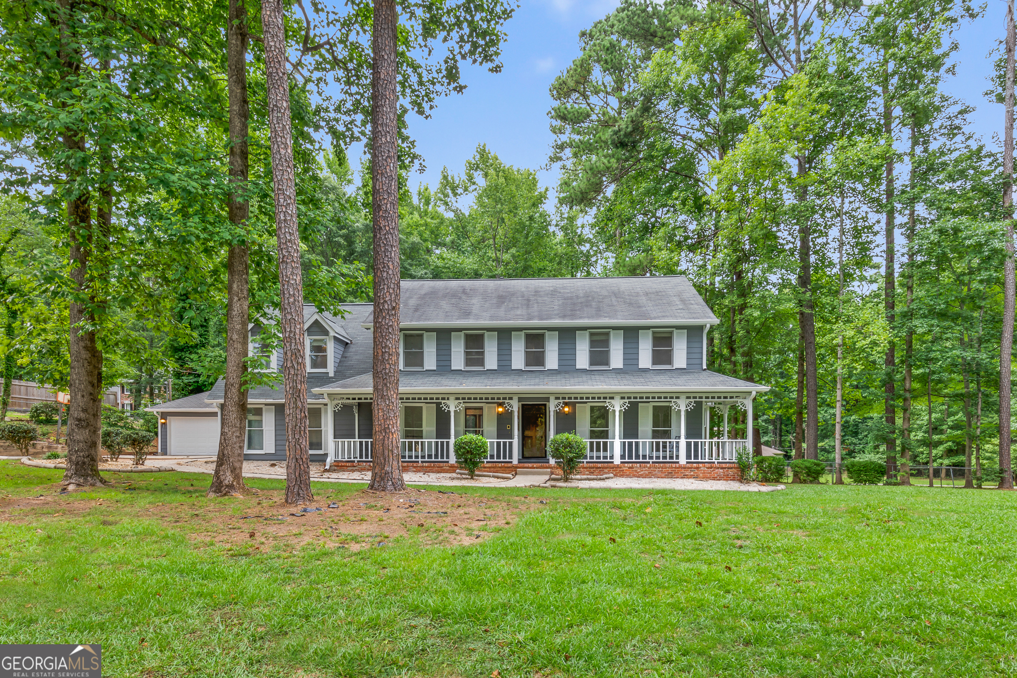 front view of a house with a yard