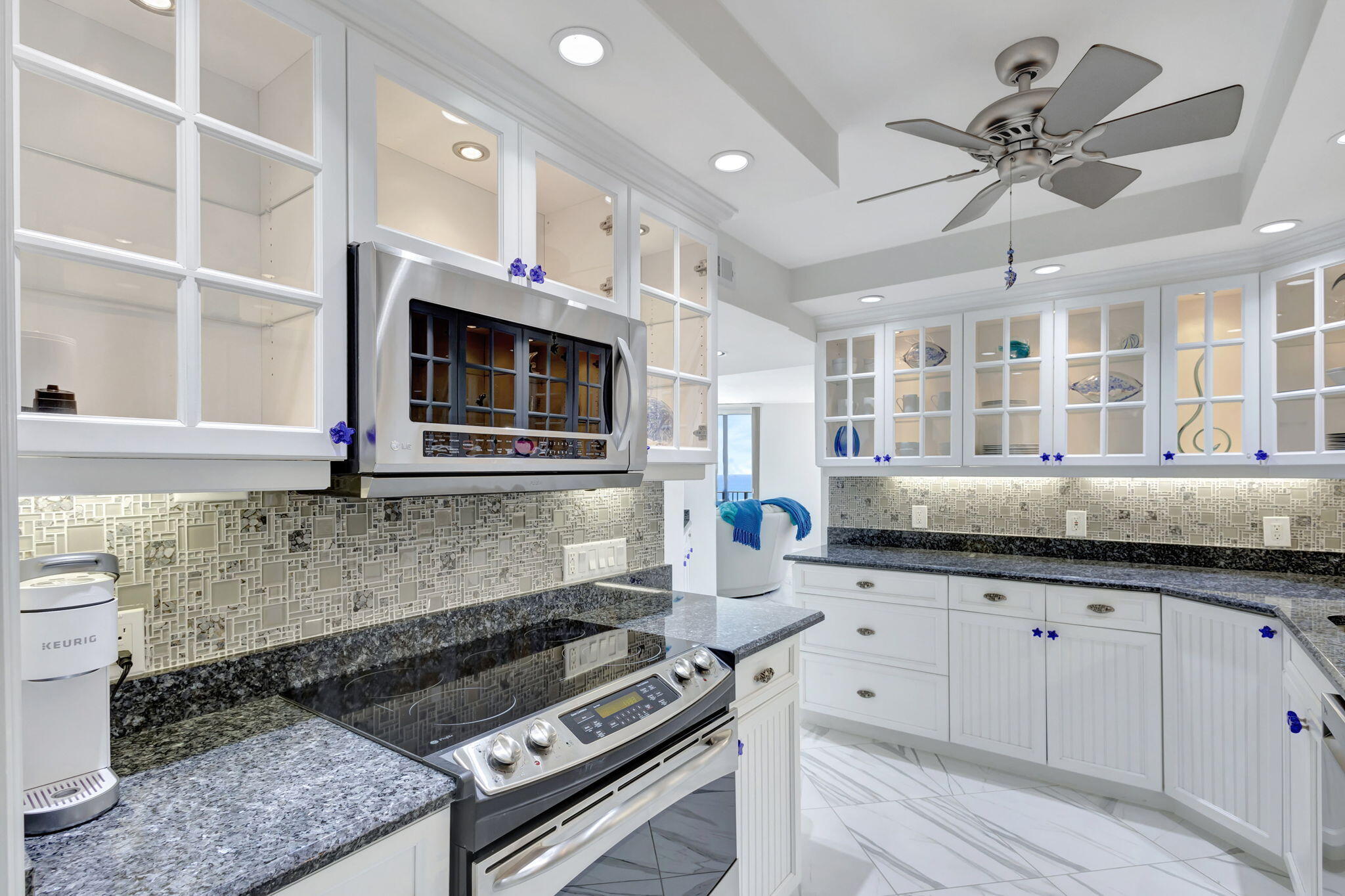 a kitchen with stainless steel appliances granite countertop a stove and a sink