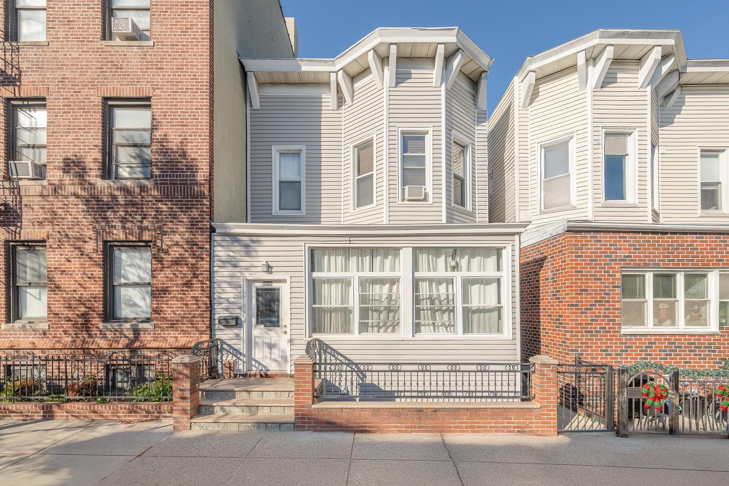 View of front of home featuring cooling unit