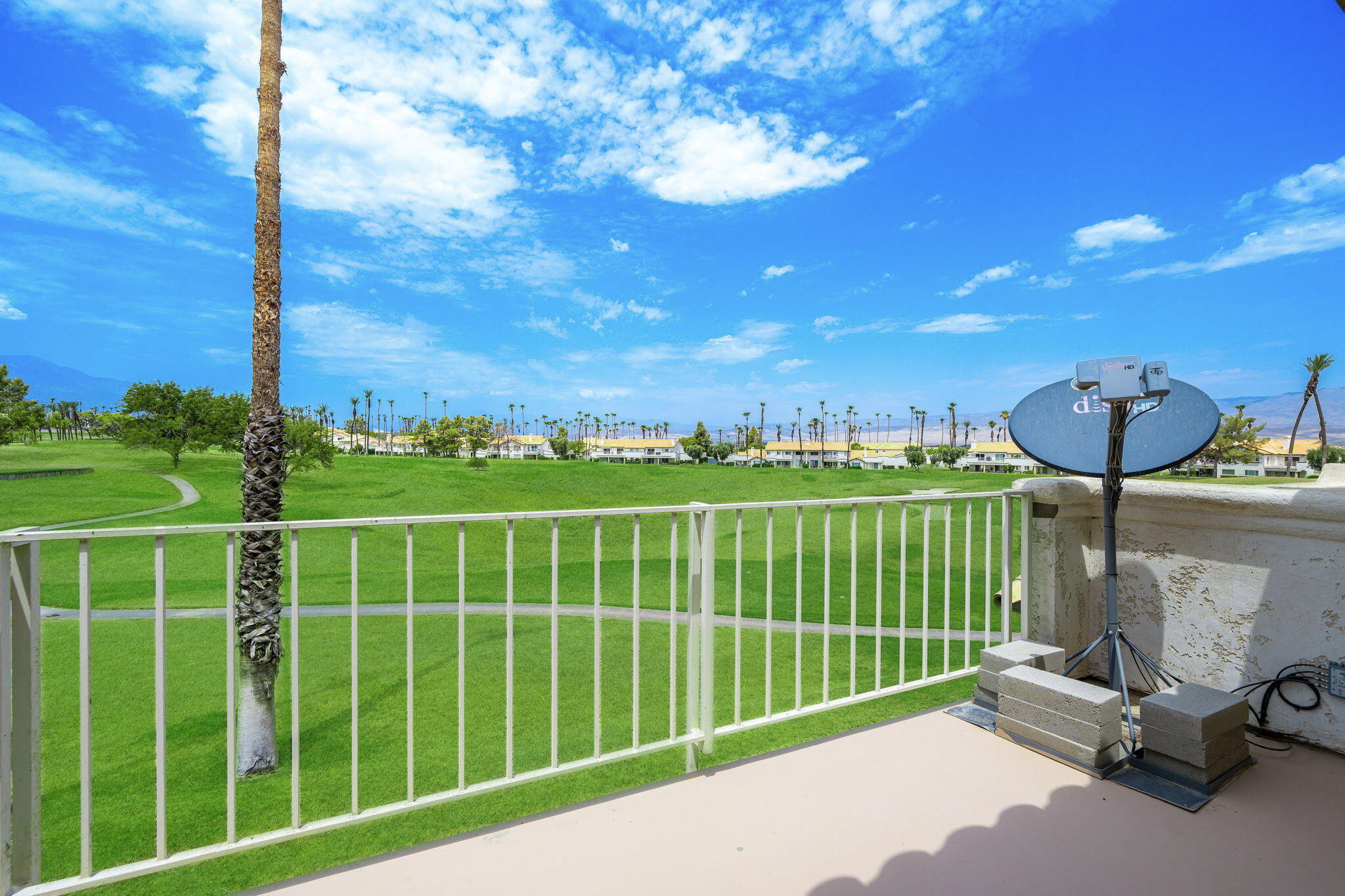 a view of a balcony with a swing