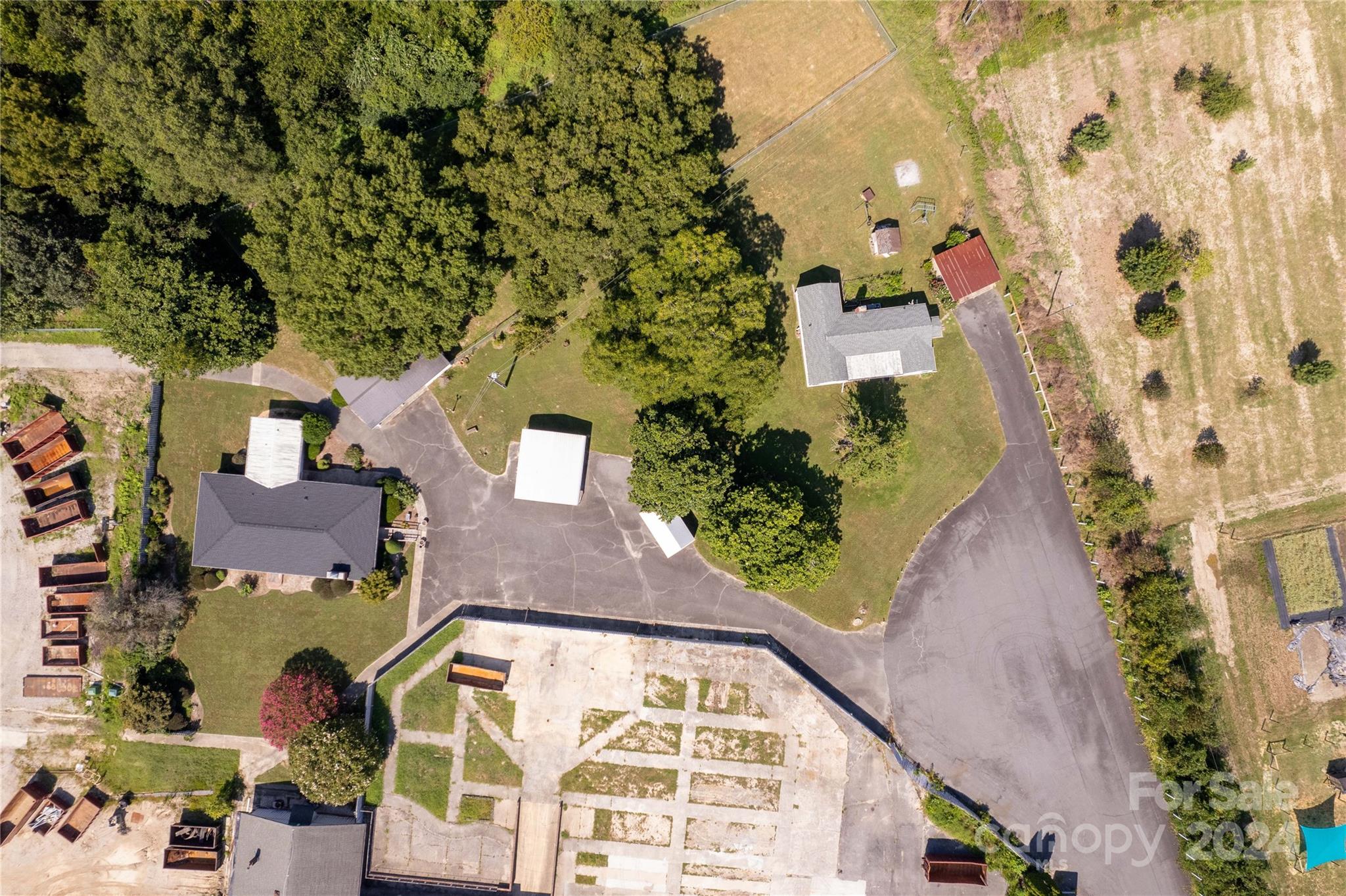 an aerial view of residential house with outdoor space and swimming pool