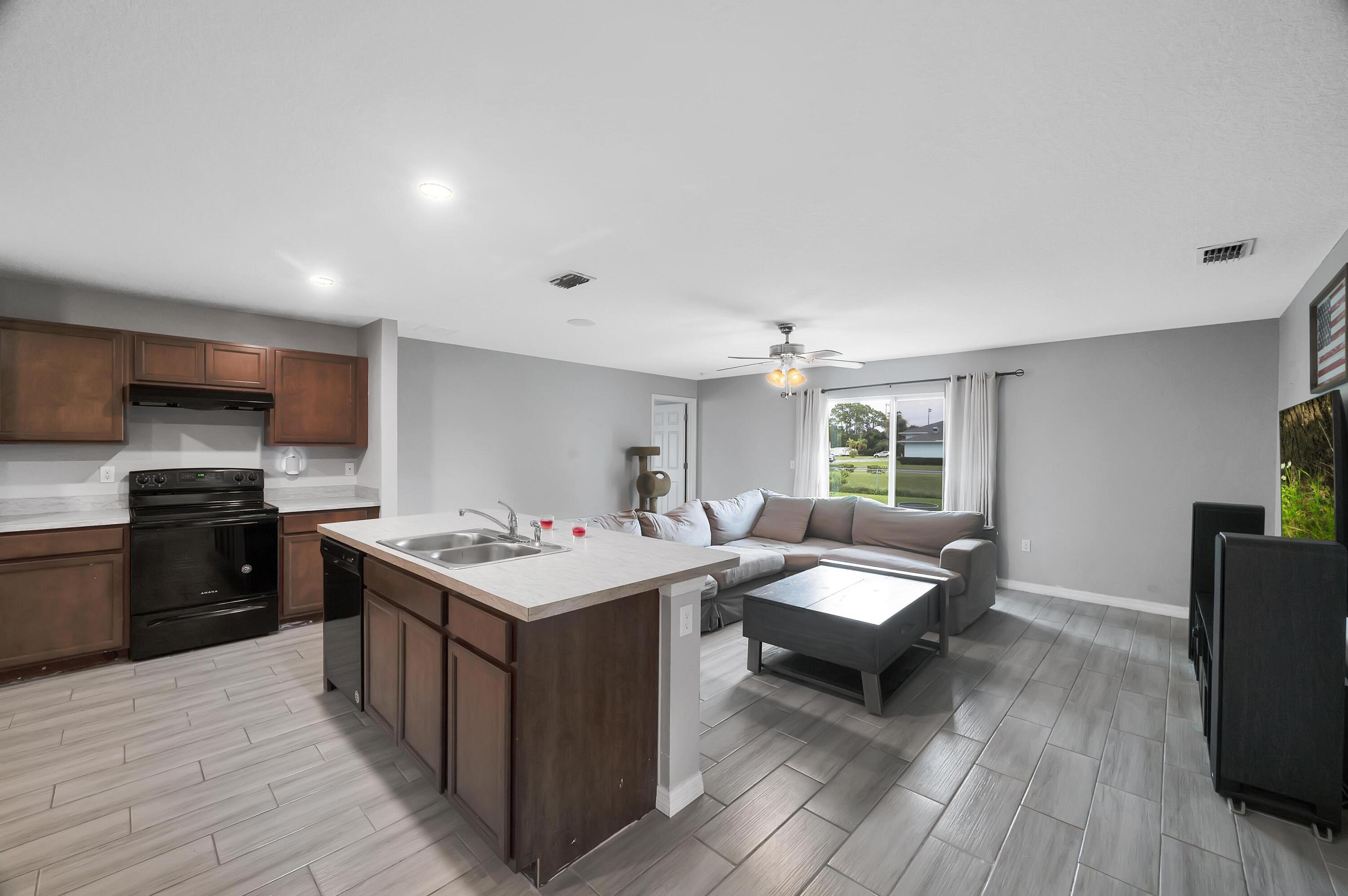 a kitchen with a stove and a refrigerator