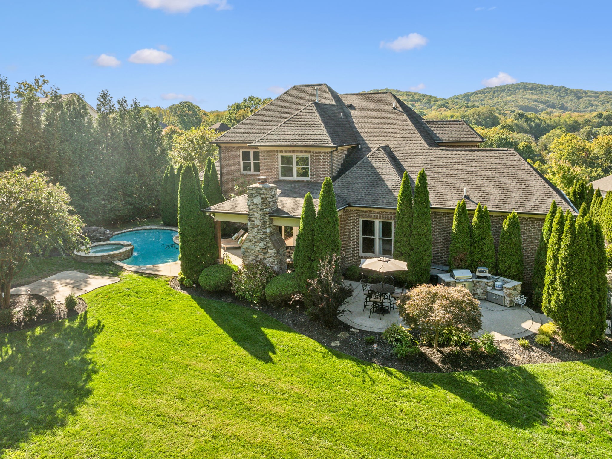 With mature landscaping and multi-zone irrigation system, this is your private backyard oasis from dips in the pool to grilling out and playing with kids/pets in the large private backyard.