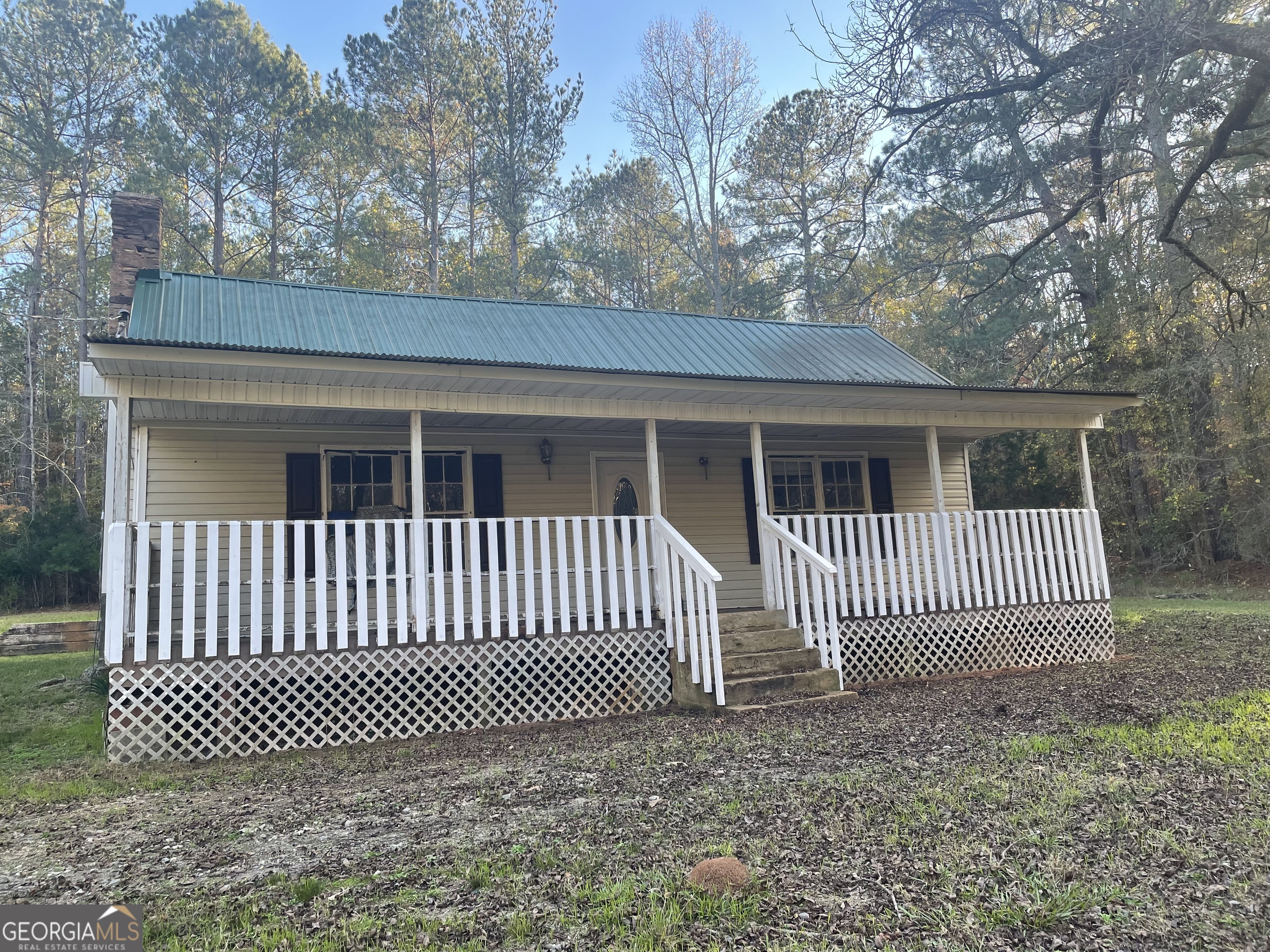 a view of a house with a gate