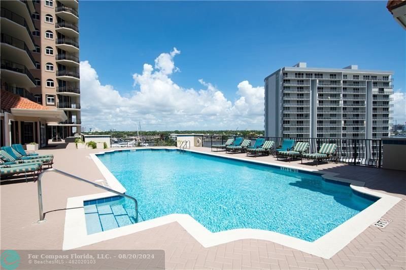 a view of a swimming pool with lounge chair