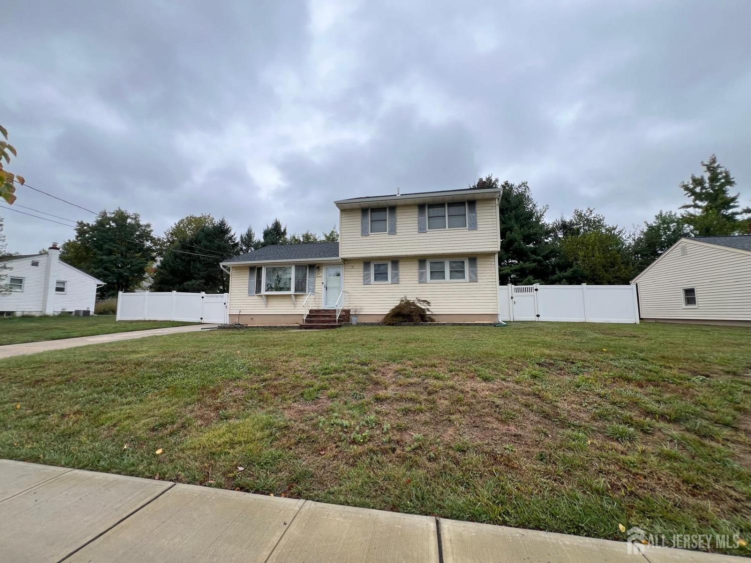 a view of a house with a yard