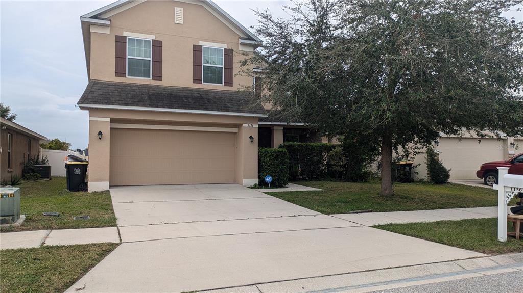 a front view of a house with yard