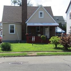 a view of a house with a yard and plants