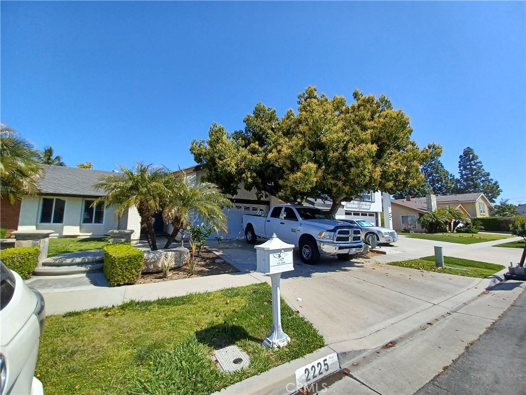 a view of a house with backyard sitting area and swimming pool