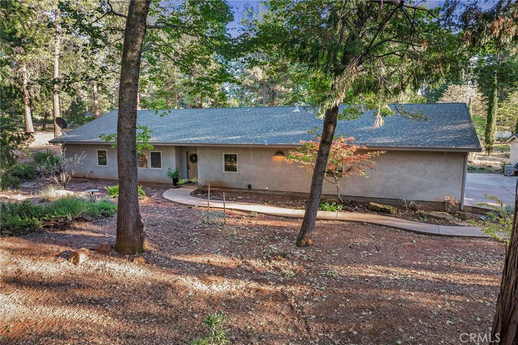 a house view with a backyard space