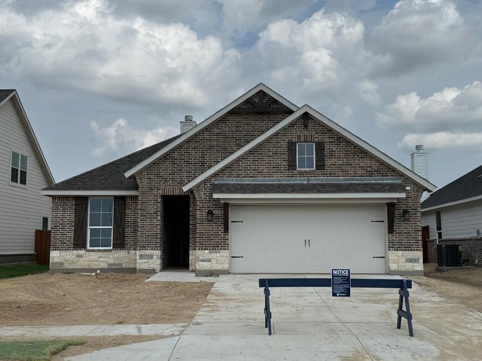 a front view of a house with garage